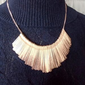 Gold Tone Fringed Shiny Metal Bib Necklace With An Adjustable Lobster Claw Clasp
